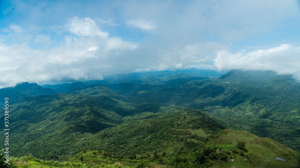 Fototapeta premium Mountain scenery with clouds during the rainy season
