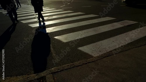 People walking on the zebra. Strong silhouettes.