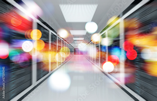 Servers data center room with bright bokeh light going through the corridor 3D rendering © sdecoret