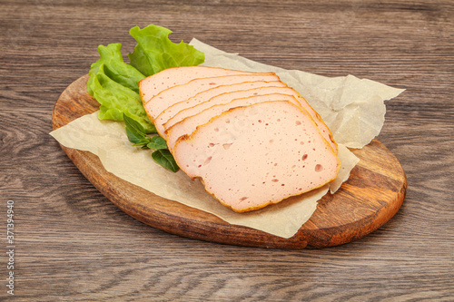 Boiled pork sausage over board