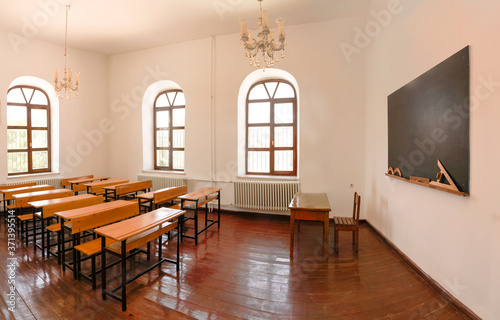 Inside view of a classroom.  Empty classroom during coronavirus. © Bilal