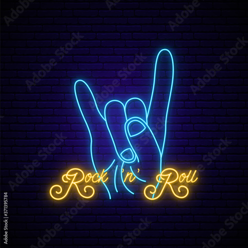 Rock music neon sign. Bright Rock and Roll emblem with hand and text. Neon signboard, light banner. Vector illustration.