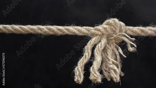 An improperly tied rope knot untied from a slight tension and broke off.