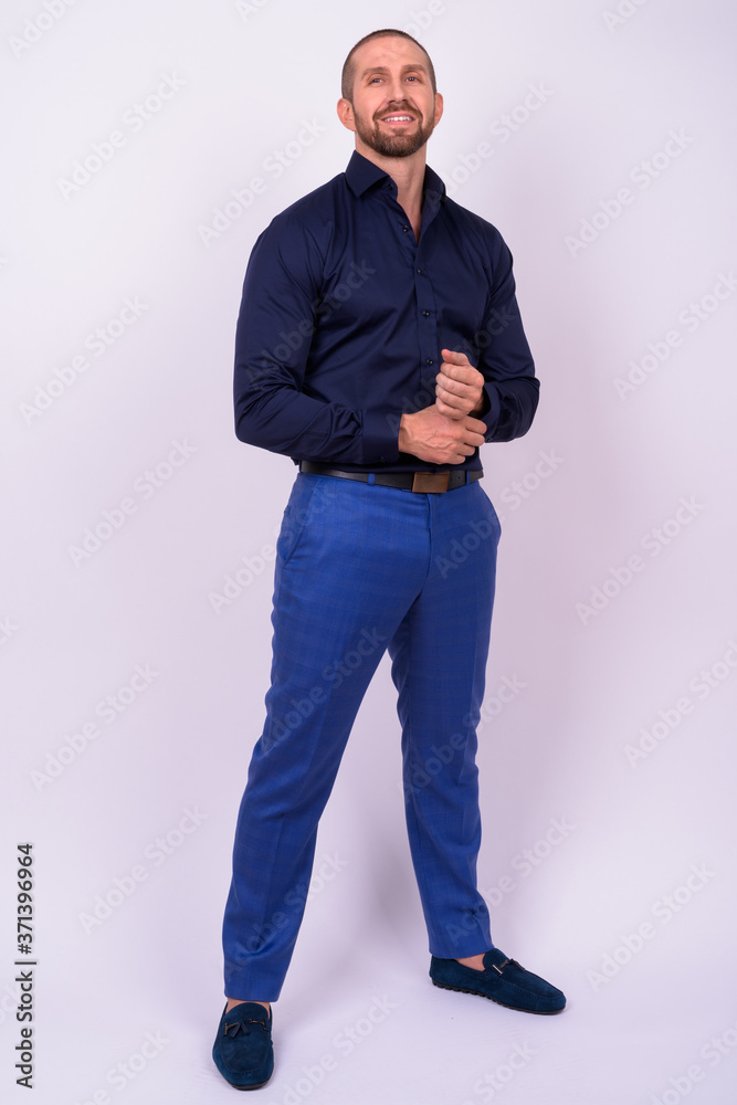 Portrait of happy handsome bald bearded businessman Portrait of happy handsome bald bearded businessman