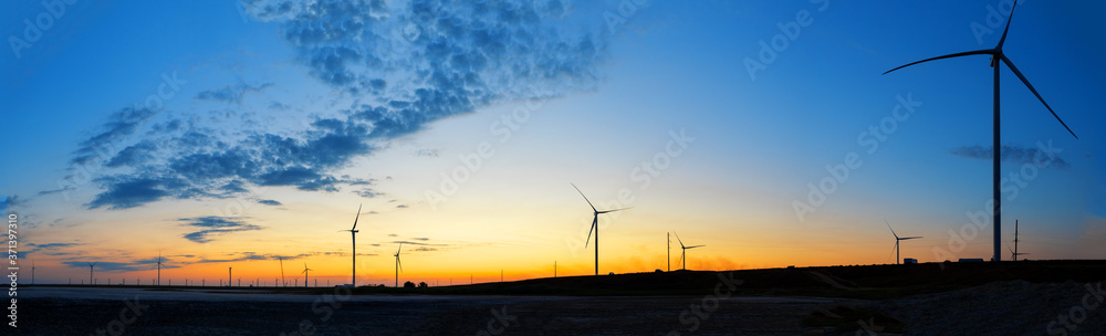 Wind farm panorama at sunset