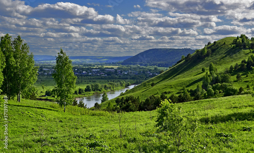Panorama of the floodplain of the Sylva river in the Kishersky district of the Perm region Under the mountain  the village of Posad. Sunny spring day in the Western Urals. in the Western Urals.