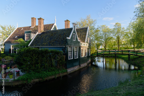 typical dutch houses by the water at sunset