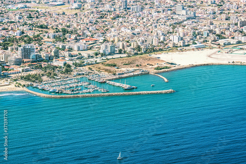 Sea port city of Larnaca, Cyprus. View from the aircraft to the coastline, beaches, seaport and the architecture of the city of Larnaca.
