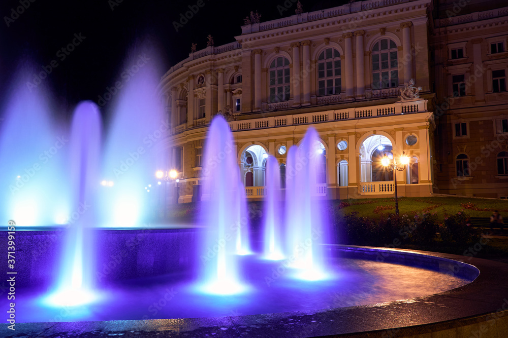 night view of Opera house in Odessa city, Ukraine. Beautiful city Park and street illumination