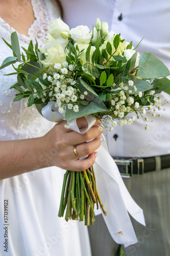 bouquet of the bride in her hands