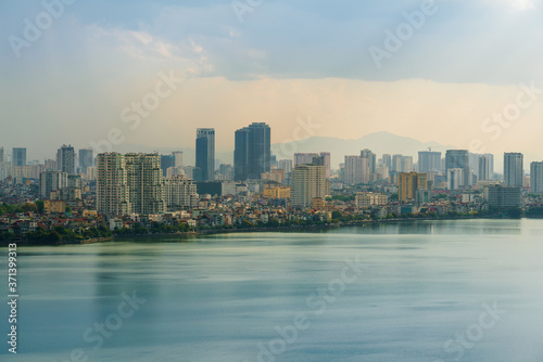 Hanoi cityscape with skyline view during sunset period at West Lake ( Ho Tay ) in 2020