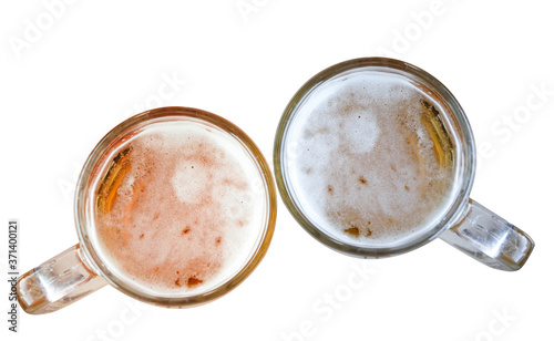 Two Fresh beer in mugs isolated on background