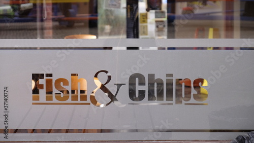 Photos Fish and chip sign etched onto a class window.