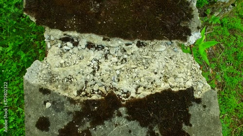 Broken, damaged concrete wall.