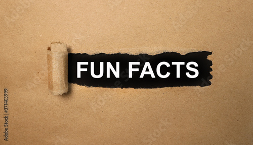 fun facts. text on black paper on torn paper photo