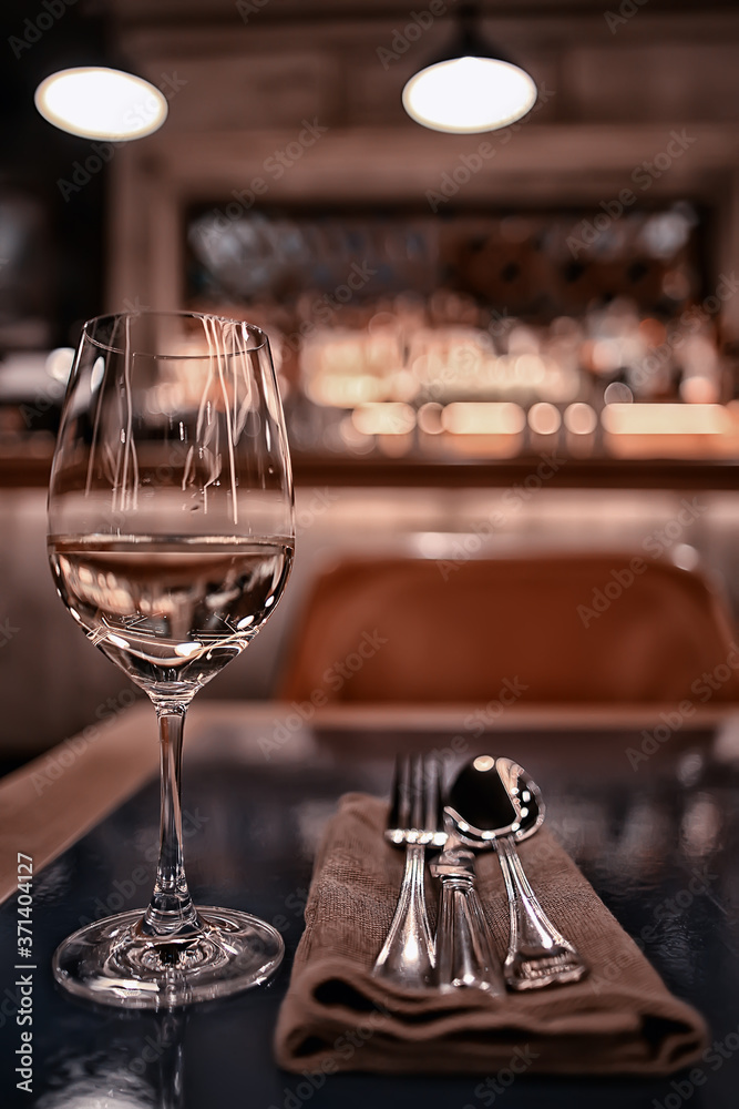 glass white wine restaurant interior, abstract evening dinner with alcohol at the bar