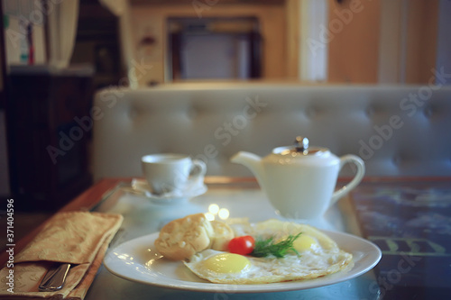 breakfast in a cafe, interior morning food hotel, teapot and cup serving restaurant