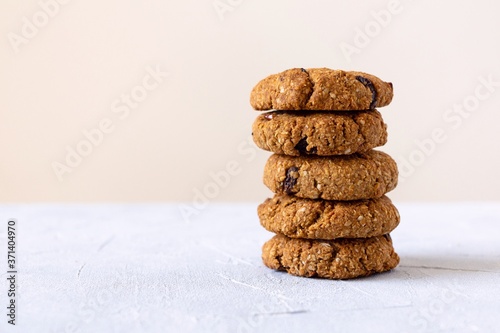 Oat cookies with raisin on light background with copy space. Healthy food and lifestile concept.