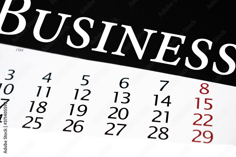 the word business on a black background above a calendar with large numbers the word business on a black background above a calendar with large numbers