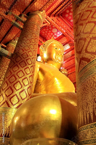 Golden Buddha statue in Wat Panan Choeng Worawihan temple are Beautiful Reclining and are famous tourist attraction in ayutthaya, Thailand. photo