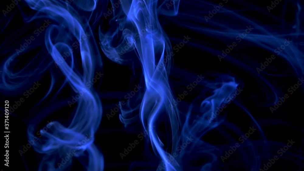 Abstract smoke cloud in the form of a spiral. Blue smoke slowly floating through space against black background. Close up. Slow motion. Abstract smoke cloud in the form of a spiral. Blue smoke slowly floating through space against black background. Close up. Slow motion.