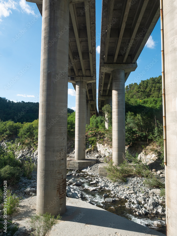 Multiple Lane Highway  bridge with reinforced concrete columns over a river