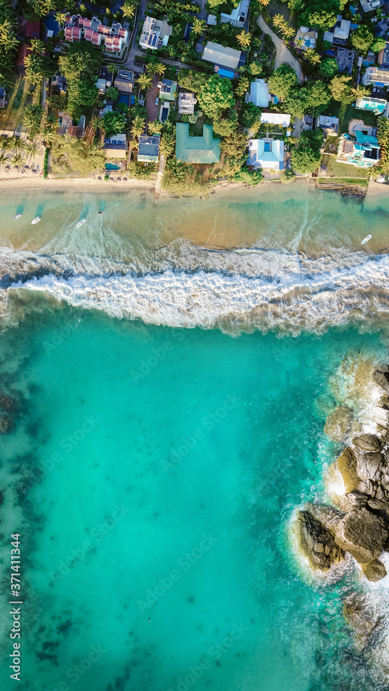 View from the drone on the azure sea with a built-in shoreline.