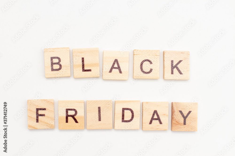 Word BLACK FRIDAY made from wooden cubes on white. Selective focus Word BLACK FRIDAY made from wooden cubes on white. Selective focus