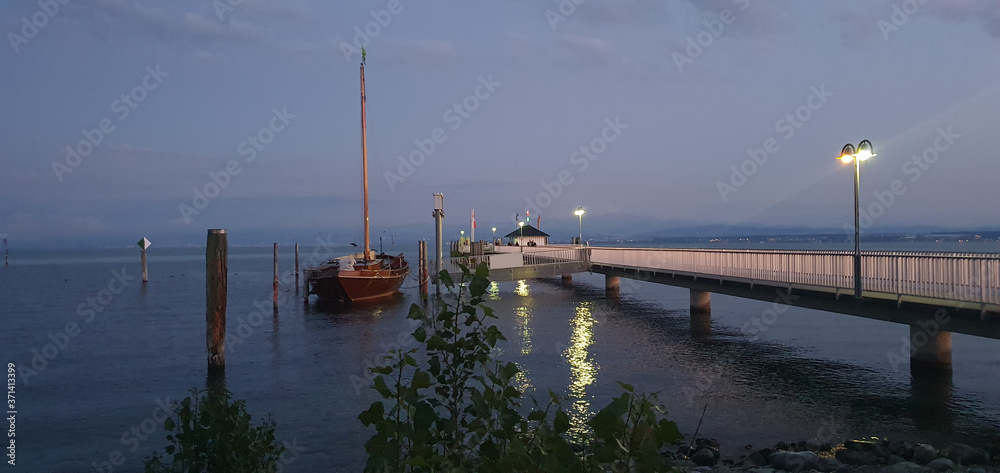 Immenstaad Lake of Constance Germany July 2020 in the evening at the harbour and pier in romantic light  