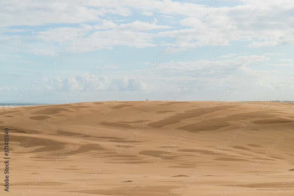 Two people at the distance on the desert. Two people at the distance on the desert.