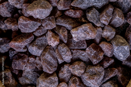 фотографія Kala namak or Black salt of South Asia on a wooden spoon