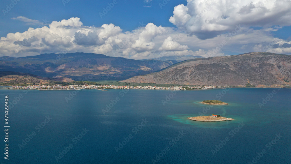 Aerial drone panoramic photo of picturesque seaside town of Itea built in the slopes of mount Parnassos, Fokida, Greece