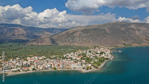 Aerial drone panoramic photo of picturesque seaside town of Itea built in the slopes of mount Parnassos, Fokida, Greece