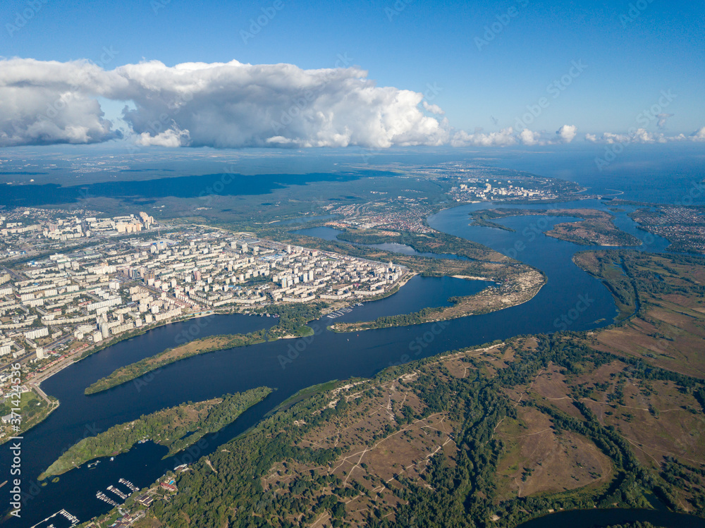 Fototapeta premium High view of the Dnieper river in Kiev. A cloud over the city.