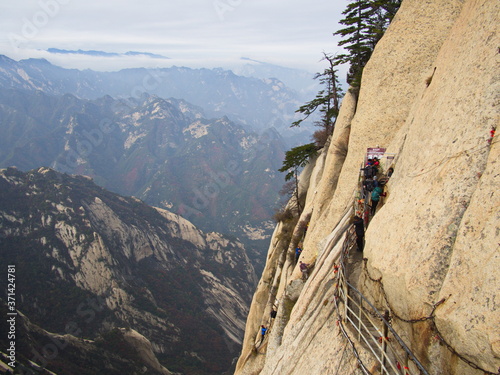 Huashan Mountain near Xian City. The Most dangerous Trail and Crowned People in China. Mount Hua is one of the Five Great Mountains of China in Huayin City, Shaanxi Province, China, 18th October 2018 photo