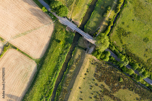 Beautiful drone landscape image over lush green Summer English countryside during late afternoon light