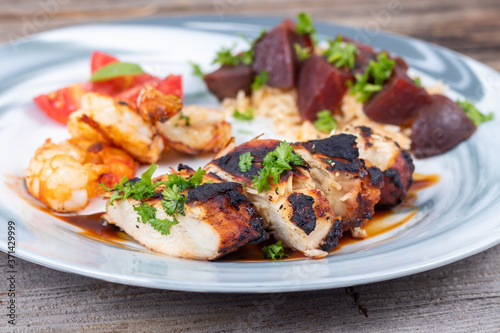 grilled chicken breast dish with shrimps and beets
