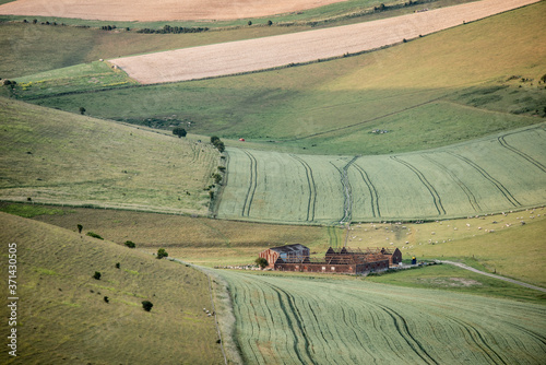 Lovely landscape image of agricultural English countryside during warm late afternoon Summer light