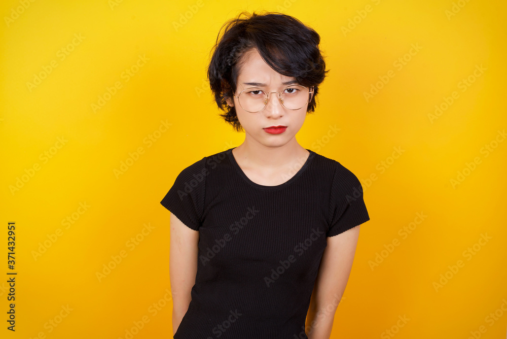 Portrait of outraged young woman with oval face, frowning her eyebrows being displeased with something. Portrait of outraged young woman with oval face, frowning her eyebrows being displeased with something.