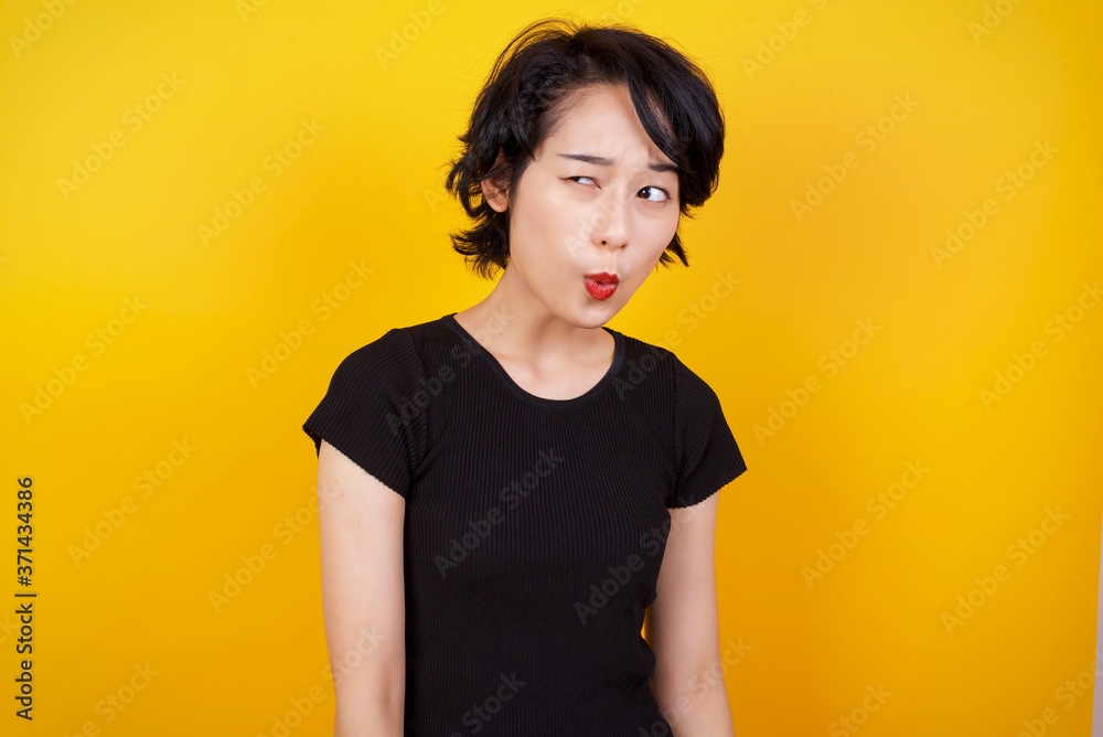 Φωτογραφία Brunette woman in casual clothes expressing disgust, unwillingness, dislike, disregard having tensive look frowning face