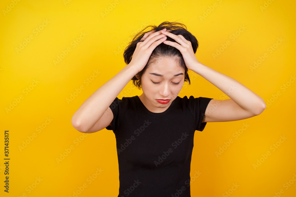 Young beautiful woman holding her head over isolated background suffering from headache desperate and stressed because pain and migraine. Hands on head. Young beautiful woman holding her head over isolated background suffering from headache desperate and stressed because pain and migraine. Hands on head.
