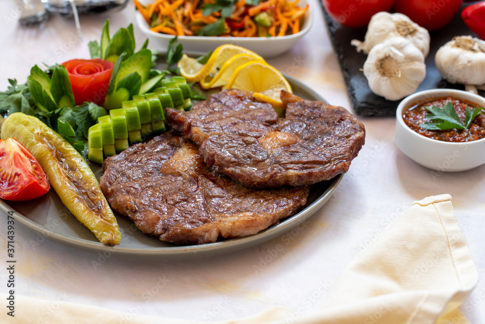 Isolated grilled beef steak on a wooden board