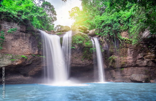 Fototapeta Naklejka Na Ścianę i Meble -  Travel to the beautiful waterfall in deep forest, soft water of the stream in the natural park at Haew Suwat Waterfall at Khao Yai National Park, Thailand