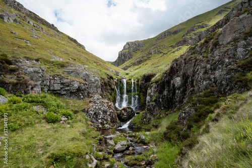 Obraz na plátně Cheviot Hills in north east England. The 3 sisters waterfall