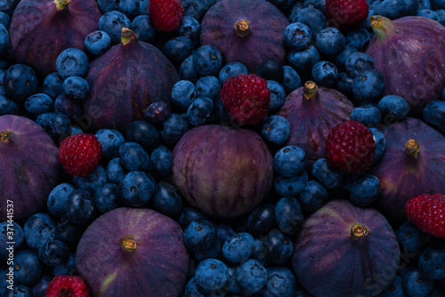 Blueberries  figs  raspberries background.