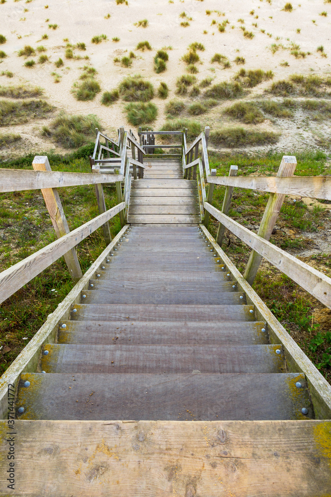 wooden steps heading down over the beach and sand dunes at Lowestoft Suffolk wooden steps heading down over the beach and sand dunes at Lowestoft Suffolk