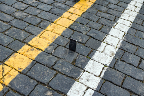 Picture smartphone on the stones paving.