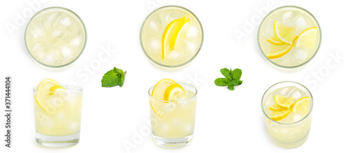 Fotografie, Obraz Glass with lemon lemonade and ice on a white background