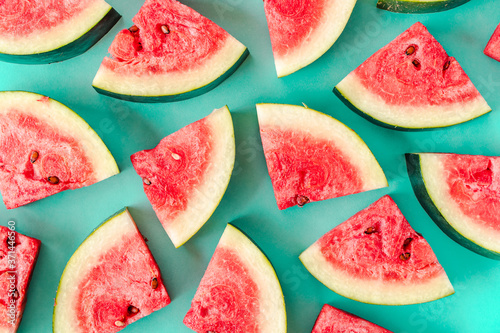 Water melon slices on blue background. Stock photo