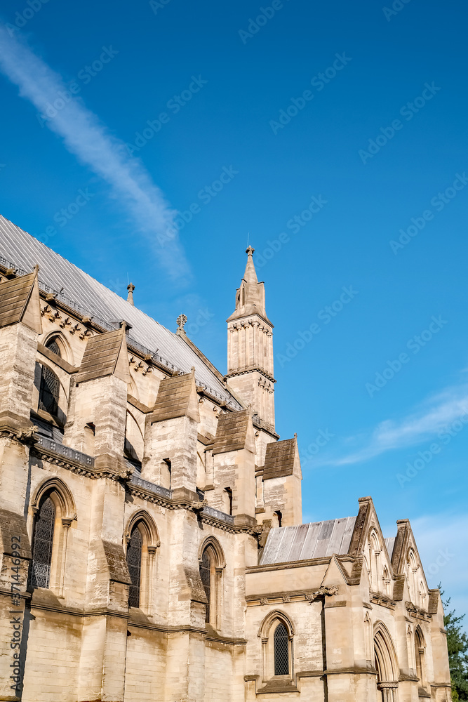 Seelctive view of the side of a medieval Roman Catholic cathedral in the city of Norwich in Norfolk, England